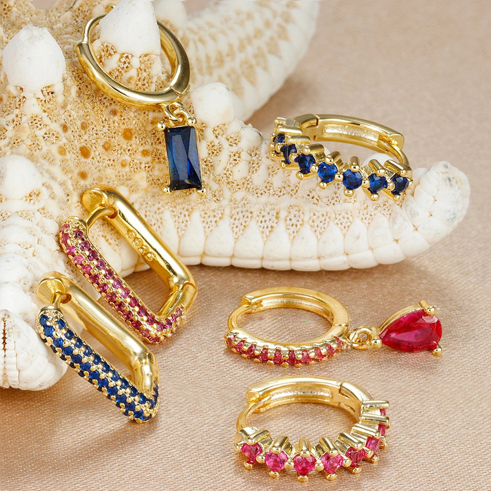 Set mit 3 goldenen Ohrringen – U-förmige Creolen und Zirkonia-Tropfenanhänger