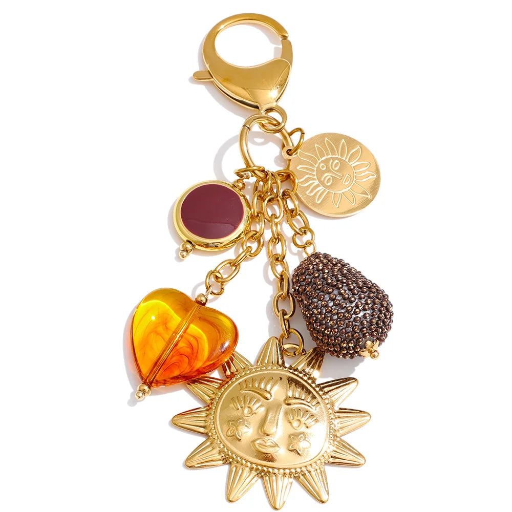 Porte-clés pendentif soleil et cœur en résine dorée